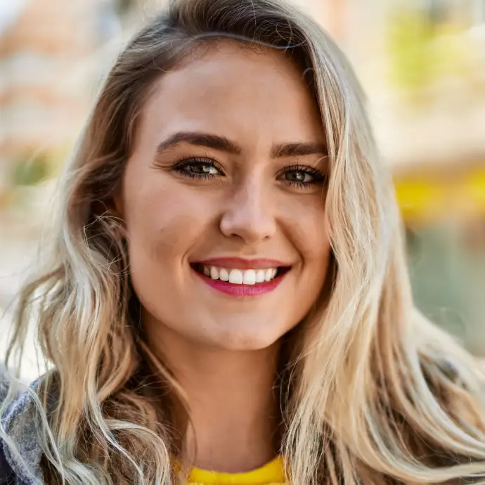 A girl smiling with no cavities